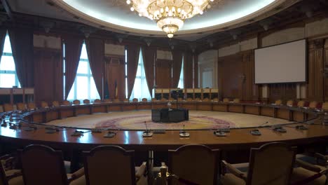 meeting room with round table and chairs in romanian parliament