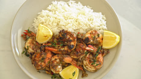 jerk shrimps or grilled shrimps in jamaica style with lemon and rice