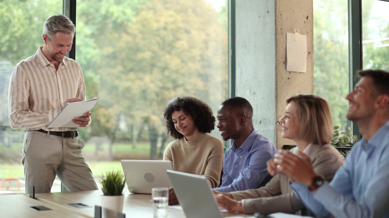 Diverse Business Team Attending a Presentation in a Modern Office
