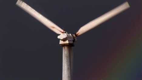 tilt up to gorgeous rainbows illuminate wind powered generators spinning 1