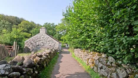 stone path leading to a rustic cottage