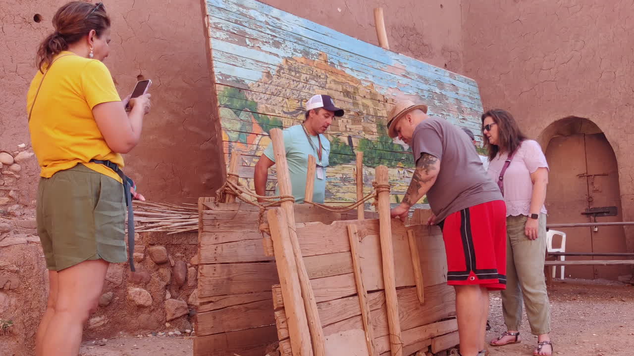 Tourists Exploring the Interiors of the Aït Ben Haddou Kasbah in Ouarzazate, Morocco - Medium Shot
