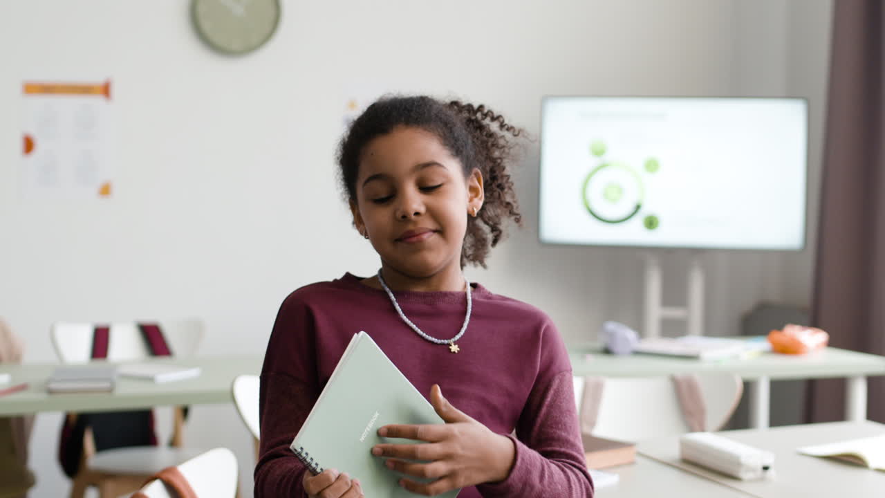 Girl Reading in Classroom