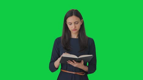 Indian-girl-reading-a-book-Green-screen