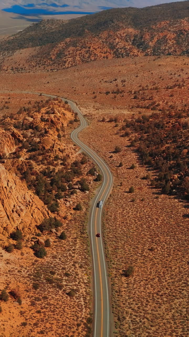 Nevada road California desert. Aerial view of american desert highway. Vertical video