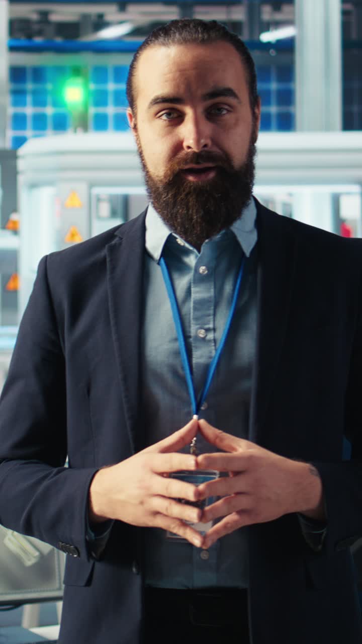 Vertical Video Man In Solar Panel Manufacturing Facility Presents Green Energy Production