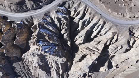 Aerial View of a Mountainous Valley with Winding Road