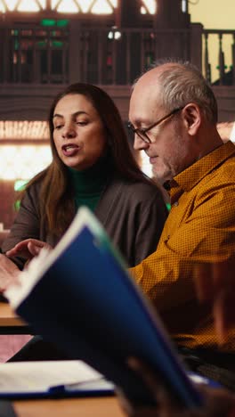 vertical video annoyed woman asking people to keep the library rules and be quiet