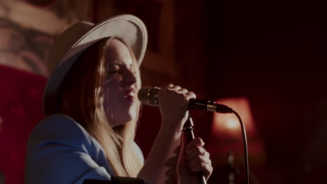 female singer performing live on stage