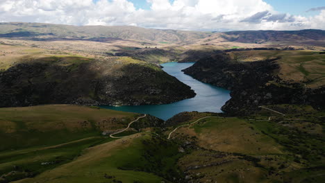iconic new zealand landscape with river and mountains, aerial view