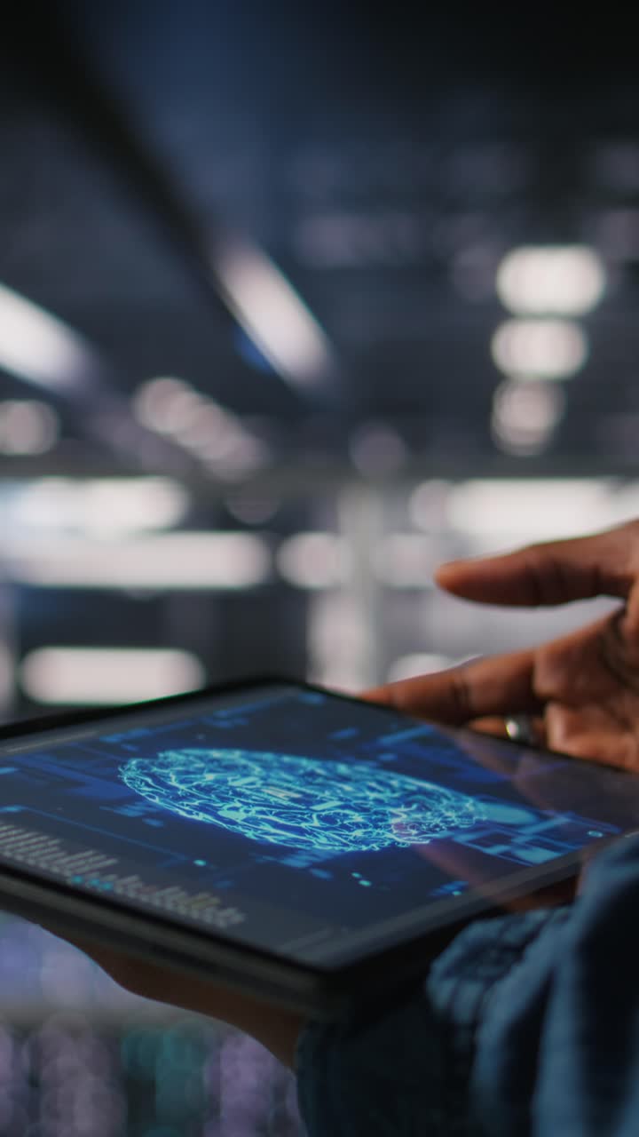 Vertical video Close up of data center engineer using tablet, doing maintenance on AI rigs