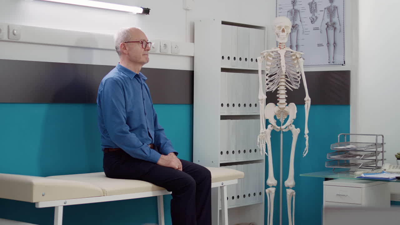 Senior man waiting for medical consultation in doctor's office