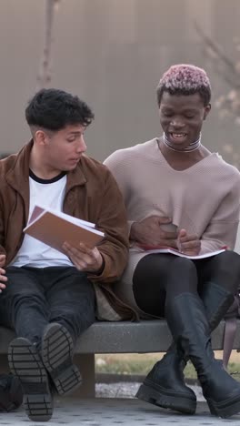 couple of friends enjoying while chatting together in the university