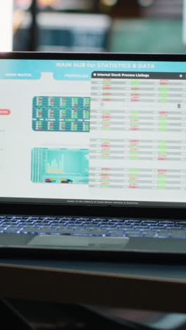 vertical video laptop in a dark office multinational company with business analytics