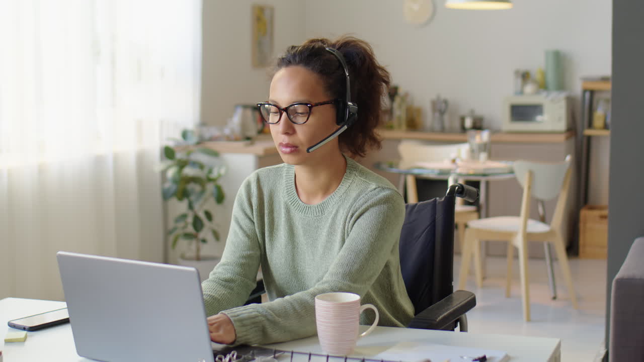Woman in Wheelchair Working as Call Center Agent