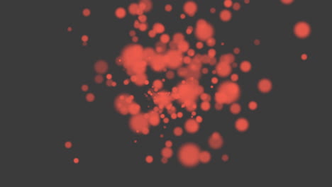 Fly-and-falling-red-round-particles-with-glitters-on-black-gradient