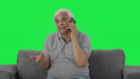 Angry-Indian-old-man-shouting-on-phone-Green-screen