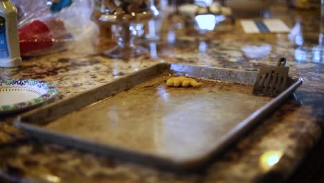 A-dirty-pan-with-leftover-chicken-nuggets-left-on-the-counter-top