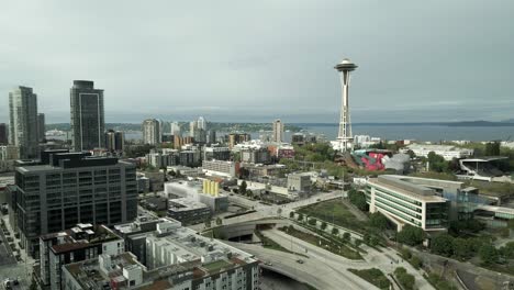 slow aerial orbit above iconic downtown seattle washington, overcast skies