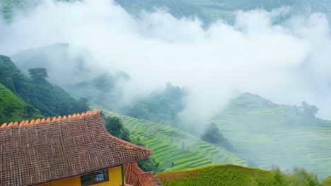 a house on top of a hill surrounded by trees and mountains