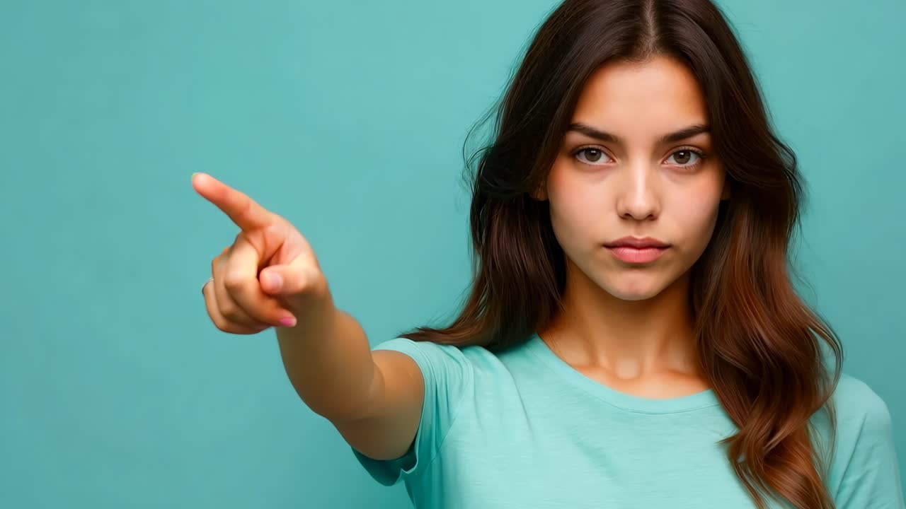 A woman pointing her finger at the camera