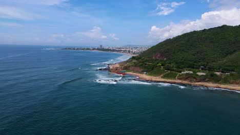 aerial drone shot capturing a shipwreck off the coast of vizag, with the vast ocean surrounding the eerie remains.