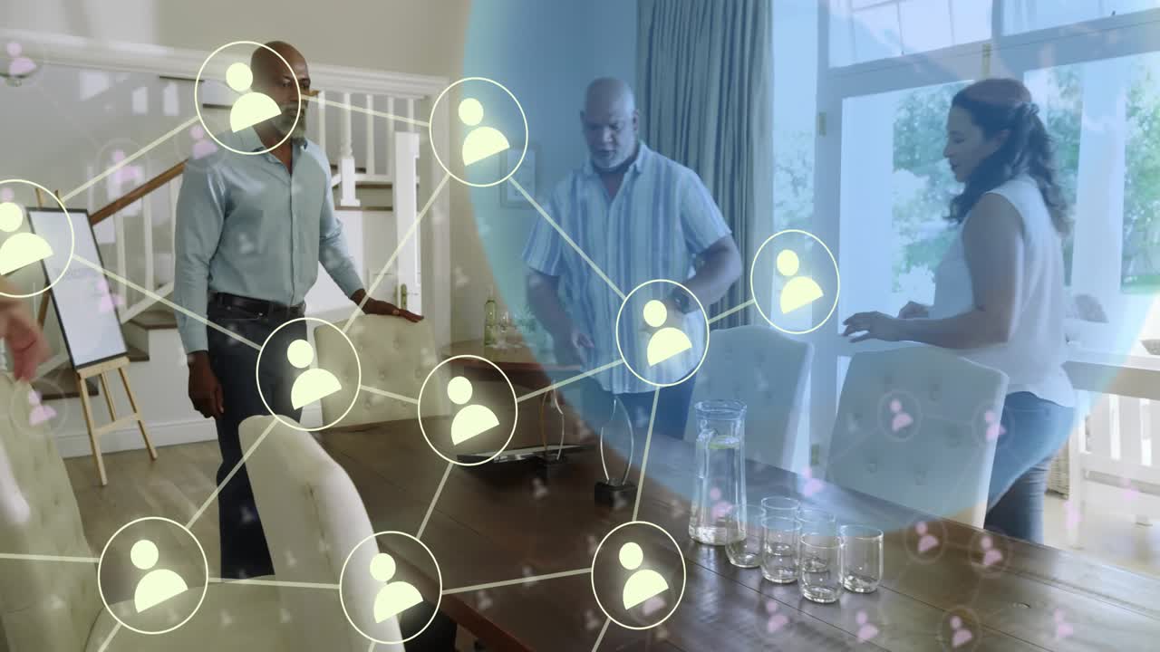 Four adults touching tablet around table, starting network nodes linking people for tech planning