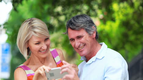 smiling couple taking selfie