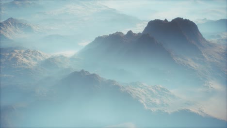 distant mountain range and thin layer of fog on the valleys