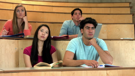 Students-sitting-beside-each-other-while-learning