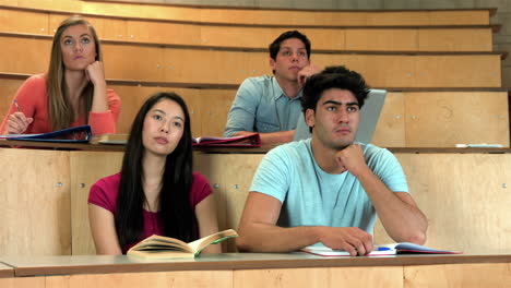students sitting beside each other while learning