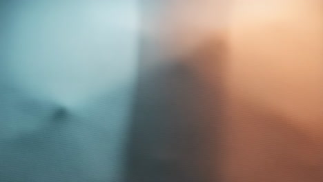 abstract blurred gradient background with teal and orange hues