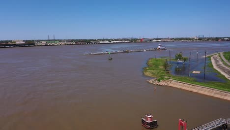 barge and pushboat on the mississippi river in new orleans
