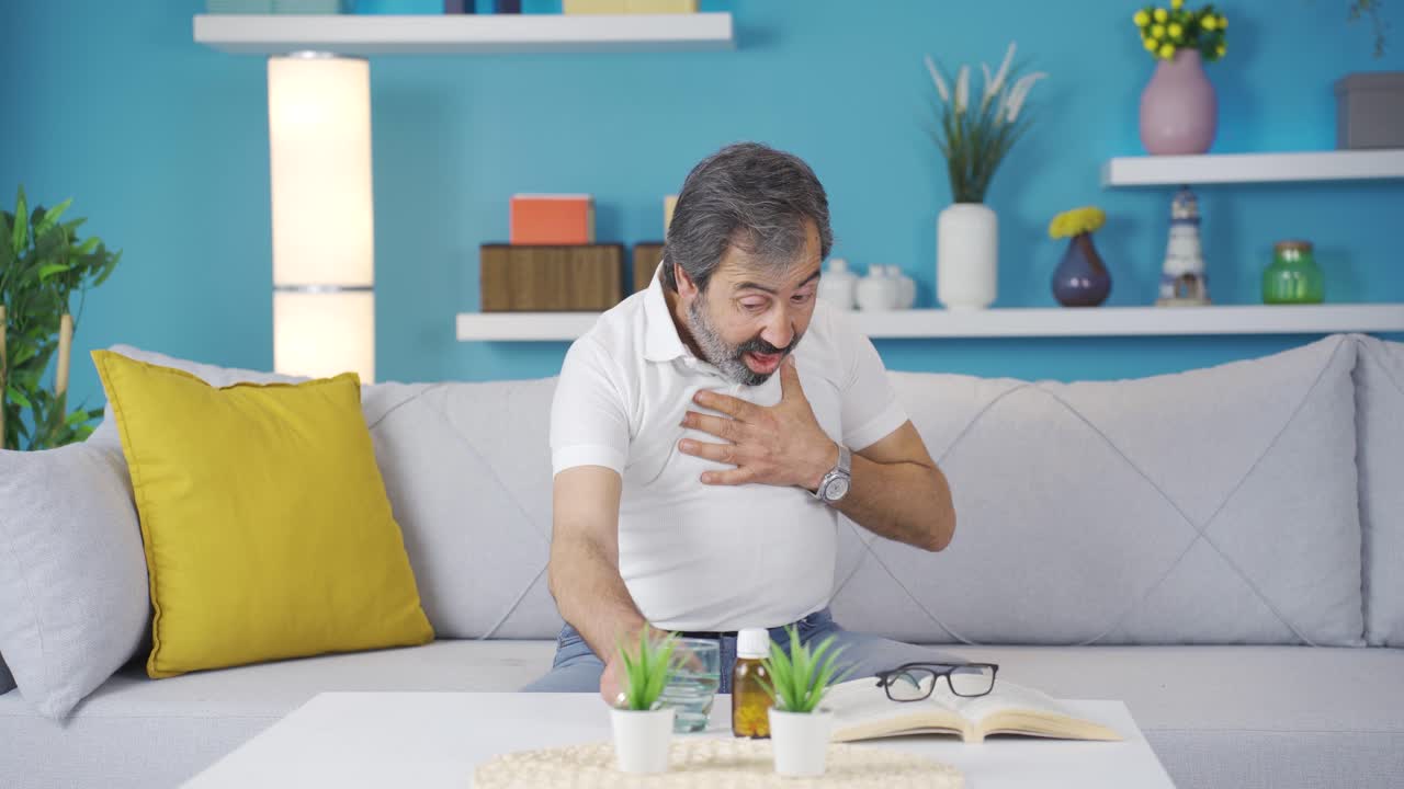 Man with shortness of breath is drinking water with difficulty.