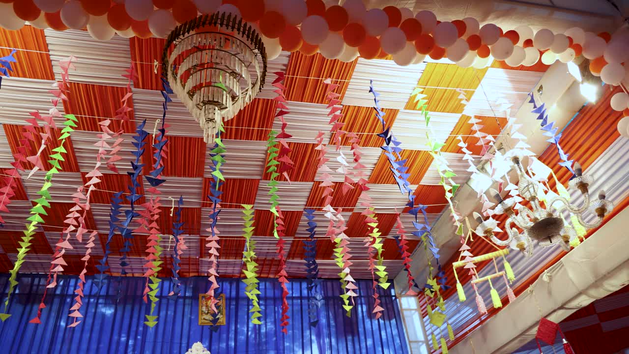 festive indoor shed with traditional colorful decorations for durga puja celebration