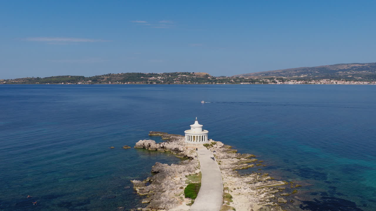 Drone circle around Saint Theodore Lighthouse on a peninsula near Argostoli, Kefalonia island, Ionian Sea