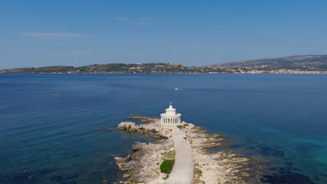drone circle around saint theodore lighthouse on a peninsula near argostoli, kefalonia island, ionian sea