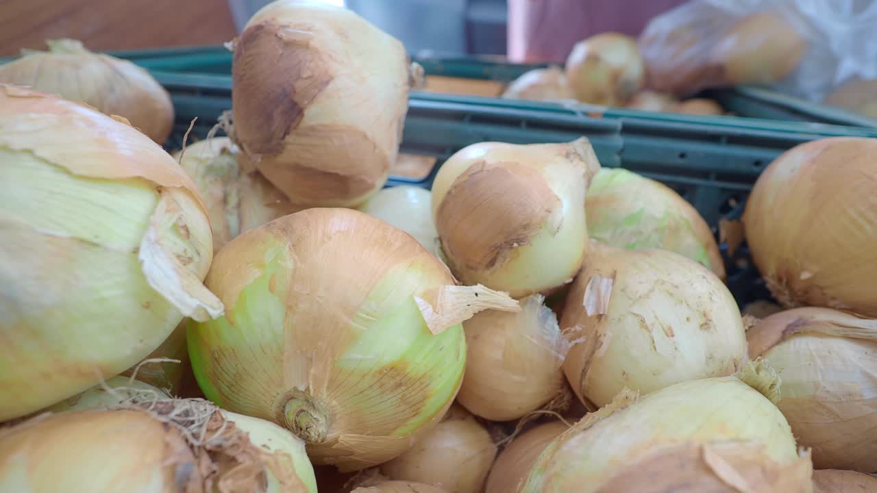 Close up of a bin of fresh white onions