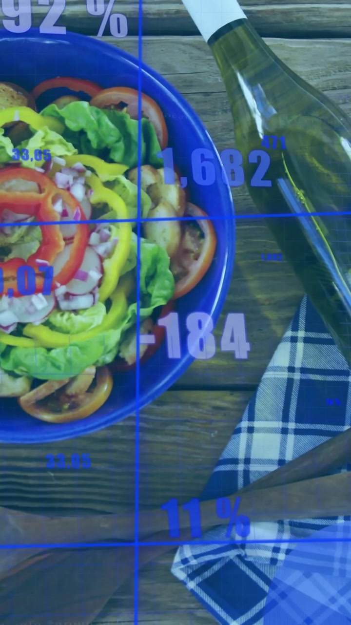 Vertical video: Camera pulling back and revealing blue bowl while HUD scanning salad for nutrition