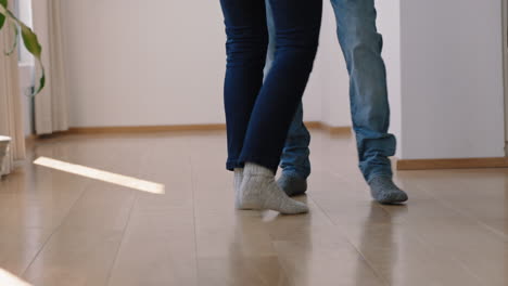 happy feet couple dancing at home enjoying successful relationship having fun celebrating anniversary retirement