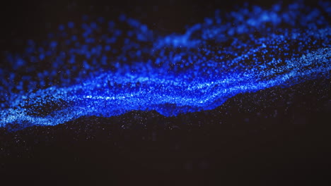 animation of blue wave of spots on black background