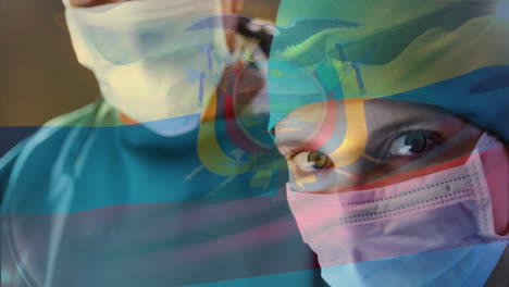 animation of flag of ecuador waving over surgeons in operating theatre