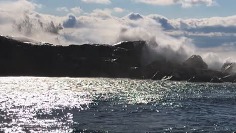 Waves-crashing-over-a-rock-wall-on-Lake-Superior,-Grand-Marais,-Minnesota