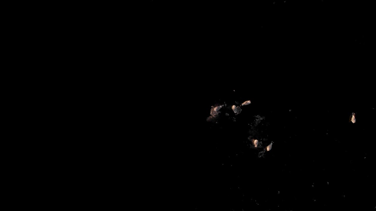 Moving drone shot of seagulls sitting on black icy water with camera straight down