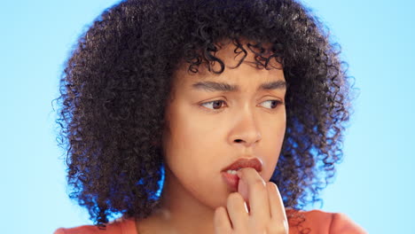 black woman is biting nails