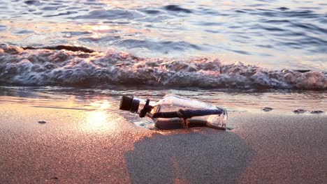 Message-in-the-bottle-against-the-Sun-setting-down