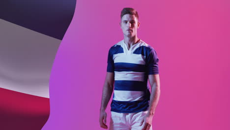 animation of flag of france over caucasian male rugby player catching ball