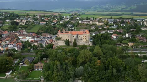 crane drone shot of grandson castle next to lake neuchatel in canton of vaud in switzerland.