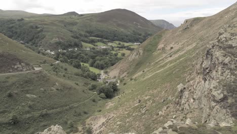 Capelulo-Penmaenmawr-Welsh-mountain-coastal-valley-aerial-view-north-wales-rising-tilt-down