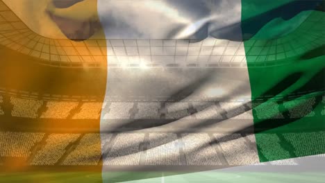 ivorian flag against soccer stadium